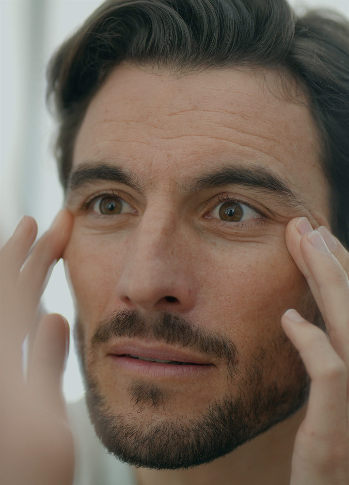 Gentleman receiving professional facial treatment