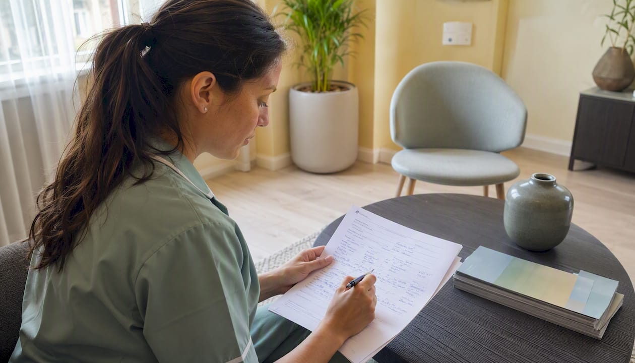 Nurse reviewing UK aesthetic aftercare form