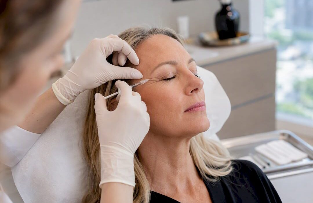 Clinician injecting botox near eye crow's feet