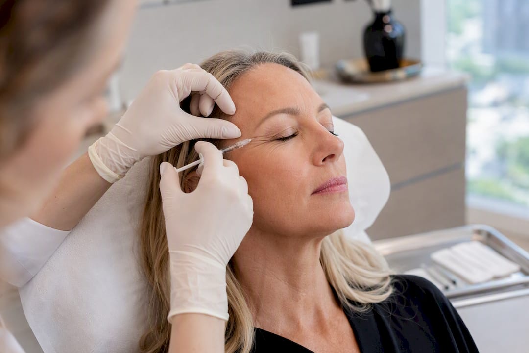 Clinician injecting botox near eye crow's feet