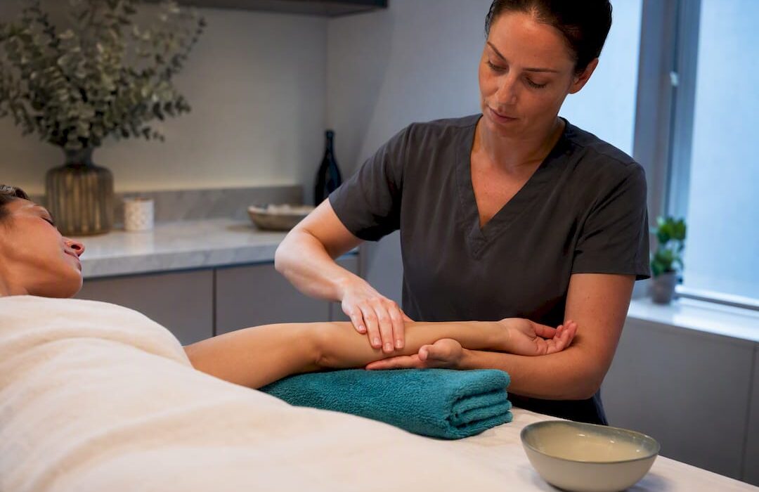 Therapist performing gentle arm lymphatic drainage